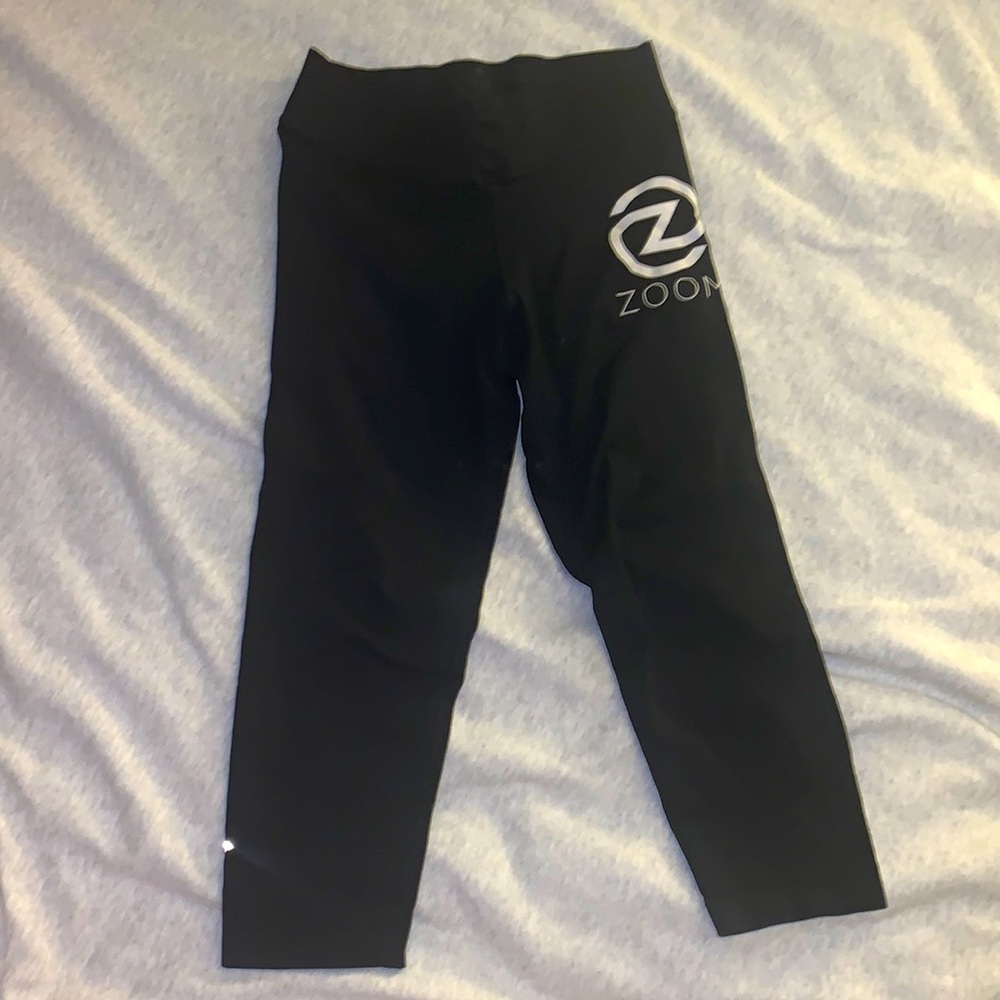 Nux leggings. Capri. Black. Size: M. Logo is a studio in Charlottesville, VA.